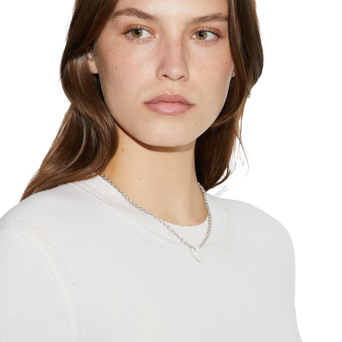 This Gucci sterling silver necklace showcases the house’s Trademark heart motif in a clean, elegant design. The polished heart pendant is engraved with the Gucci logo, creating a refined statement that balances sentimentality with modern Italian craftsmanship. Perfect for layering or wearing alone for understated designer style.