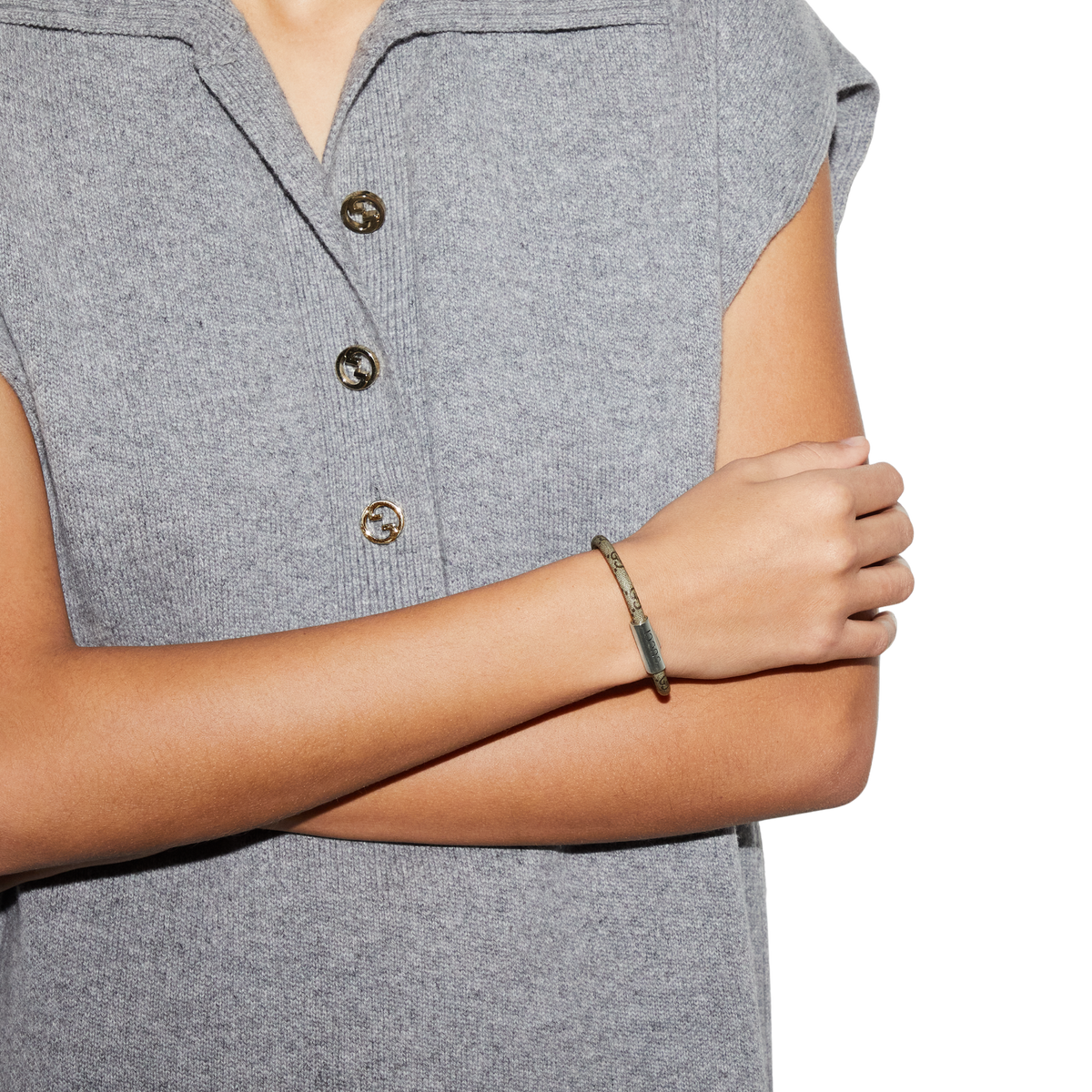 This Gucci Trademark bracelet showcases the brand’s unmistakable GG Supreme canvas paired with refined 925 sterling silver detailing. The engraved logo tag adds a subtle designer finish, while the lightweight 17cm construction ensures comfortable everyday wear. A modern piece that balances contemporary fashion with timeless Gucci identity.