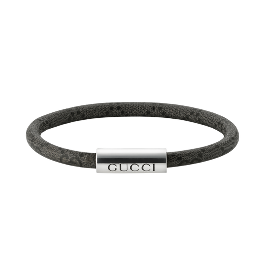 A modern interpretation of Gucci’s signature design language, this Trademark bracelet combines polished sterling silver with dark grey and black GG Supreme canvas for a sleek finish.