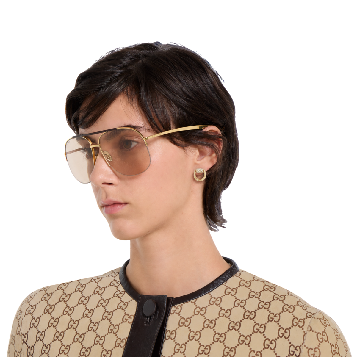 Gucci Horsebit earrings in 18ct yellow gold with brilliant round diamonds on model.