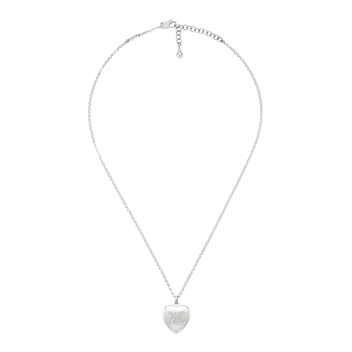 Silver heart pendant necklace featuring a polished engraved charm reading “Blind For Love”, suspended from a delicate chain for a timeless everyday look.