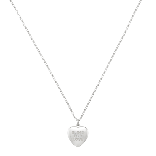 Elegant silver heart charm necklace showcasing a smooth polished finish and subtle engraved message, perfect for layering or wearing on its own.