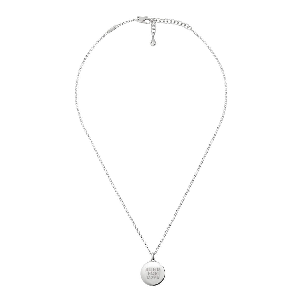 Delicate silver necklace with a round engraved charm, designed for those who appreciate modern minimalist jewellery with meaningful detail.