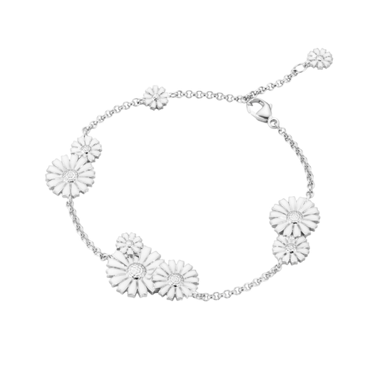Designed for effortless elegance, the White Cluster Daisy Bracelet brings a delicate floral touch to every look. Wear it alone or layer it with your favourite silver bracelets.