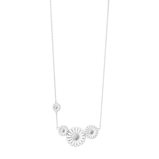 Inspired by one of Georg Jensen’s most beloved designs, this sterling silver necklace captures the beauty of a blooming daisy with exceptional attention to detail. The crisp white enamel contrasts beautifully against the polished silver, creating a look that feels both classic and contemporary.