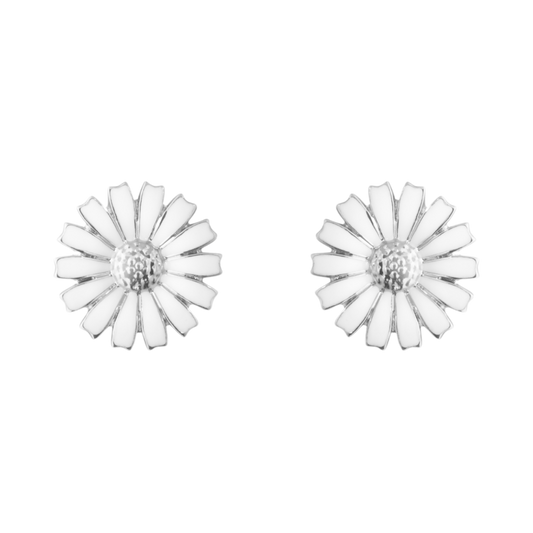 The Georg Jensen Daisy Stud Earrings capture the beauty of nature in its simplest form, featuring delicate white enamel petals set in polished sterling silver. Elegant and effortlessly wearable, they bring a fresh floral touch to both everyday looks and special occasions.