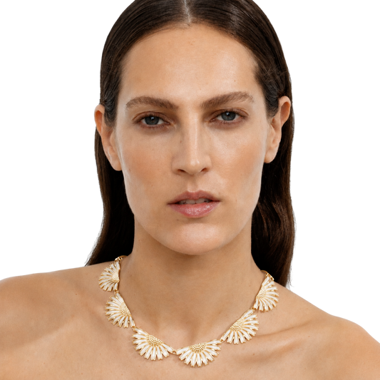 The combination of polished sterling silver and crisp white enamel creates a look that feels effortlessly feminine and modern.