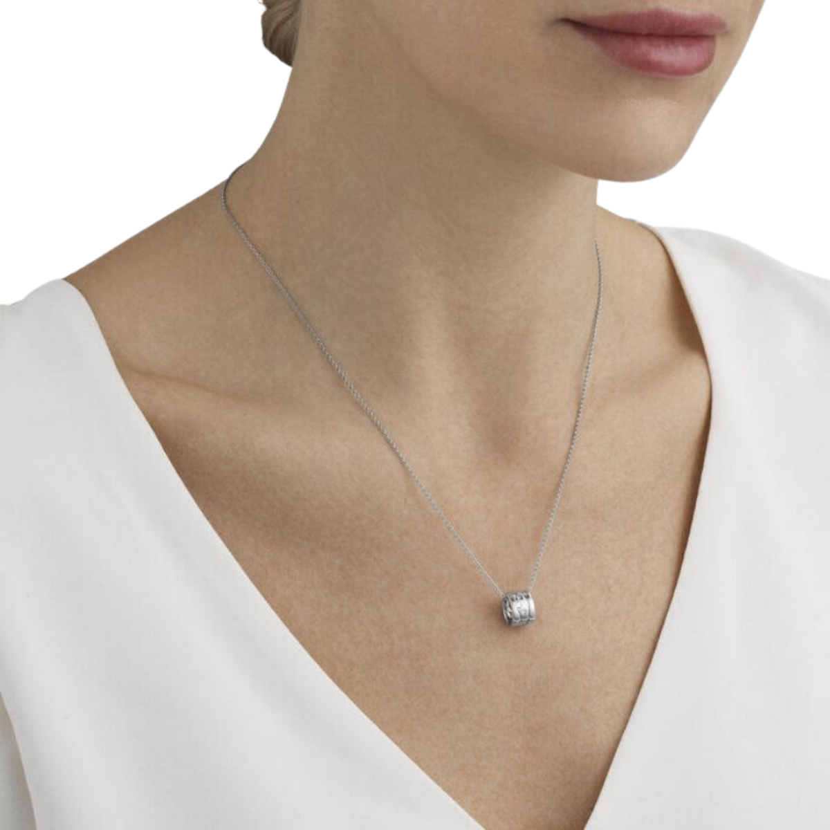 Designed by Nina Koppel, this Fusion Pendant combines sculptural 18ct white gold with delicate diamond detailing, suspended from an elegant 45cm chain.