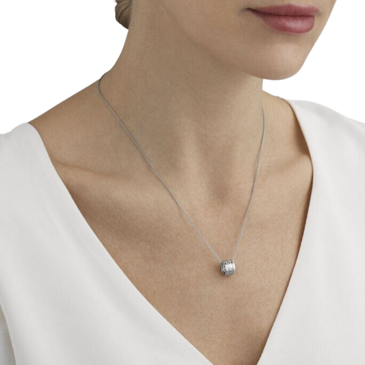 Designed by Nina Koppel, this Fusion Pendant combines sculptural 18ct white gold with delicate diamond detailing, suspended from an elegant 45cm chain.