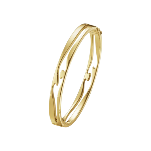 The Georg Jensen Fusion Open Bangle is crafted from 18ct yellow gold, with two flowing bands that come together in an elegant design symbolising connection and unity. Available in medium.