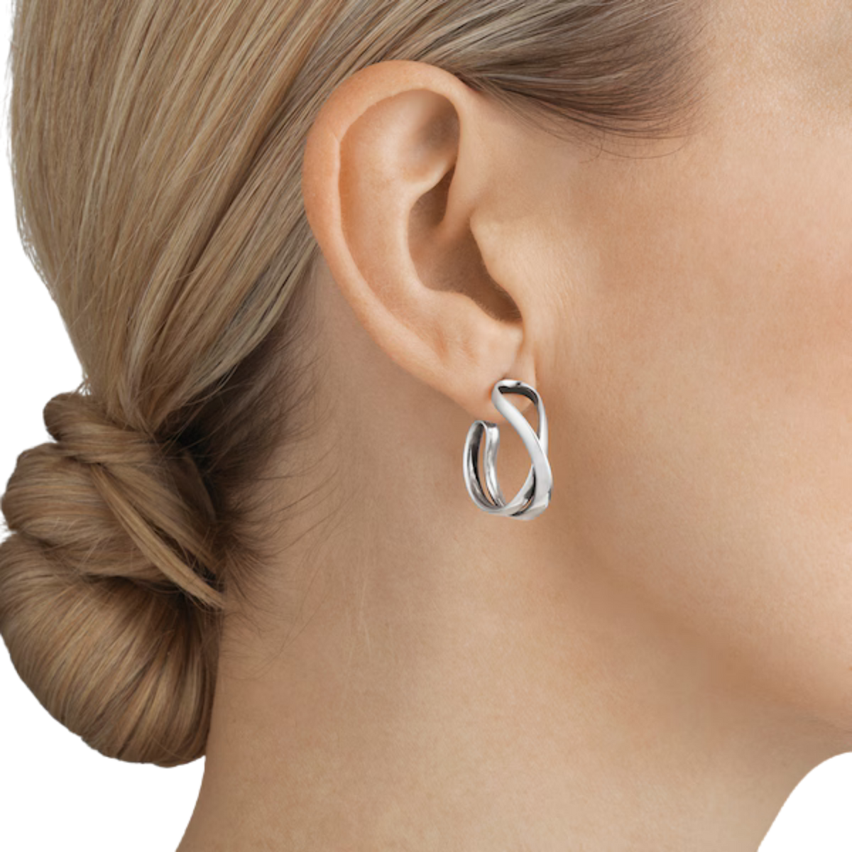 Designed by Regitze Overgaard, these sterling silver Infinity Hoop Earrings combine sculptural organic lines with timeless simplicity for effortless everyday elegance.