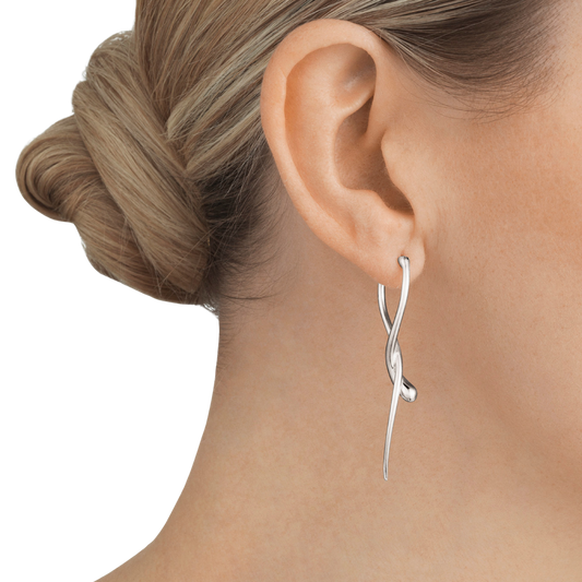 Suspended delicately from the ear, the Mercy Drop Earrings catch the light with every movement, highlighting their smooth, organic silhouette. Their lightweight design ensures comfortable wear, while their distinctive shape offers a sophisticated alternative to traditional drop earrings.