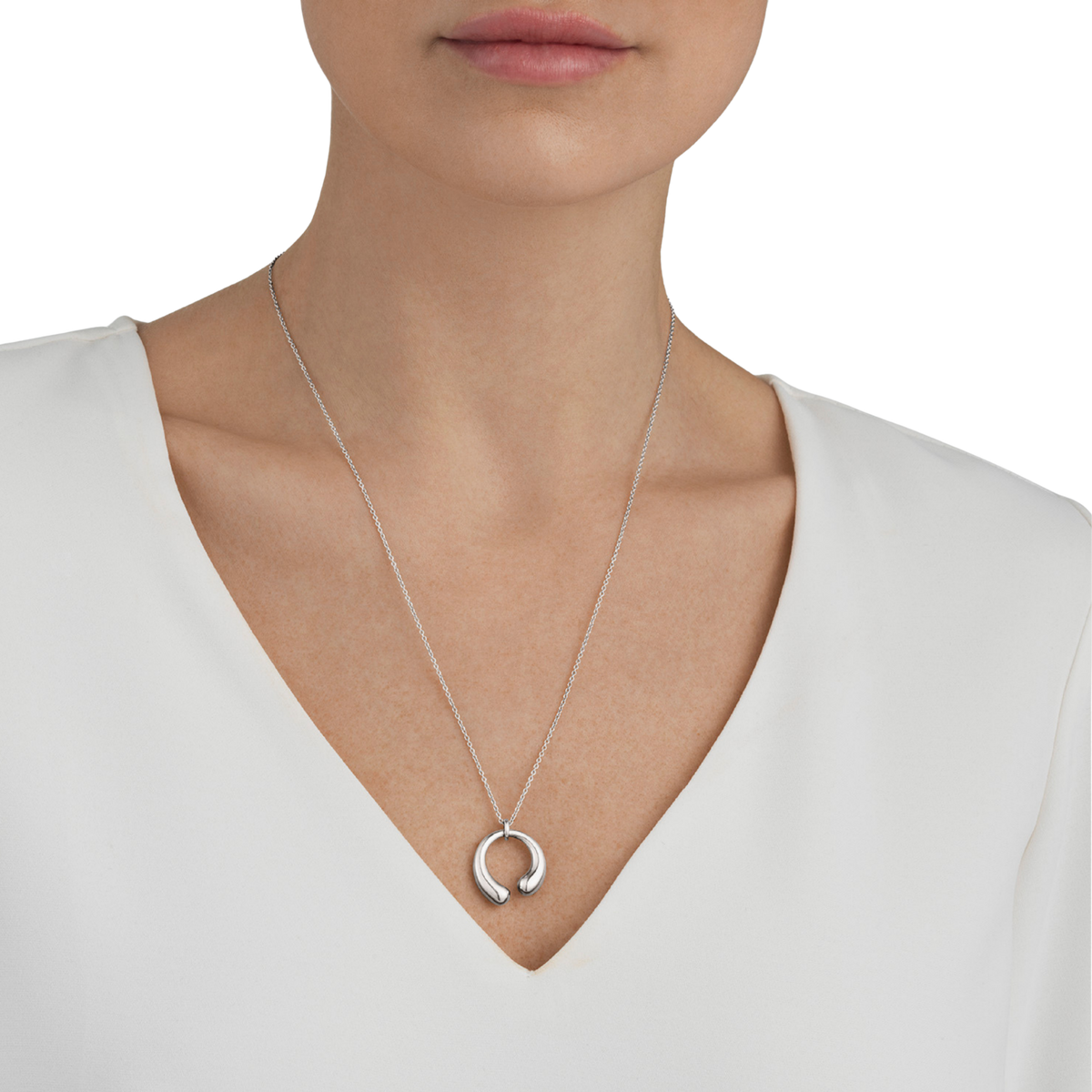 Designed by Jacqueline Rabun, the Mercy collection is recognised for its flowing lines and symbolic form.
The pendant appears to move gracefully around the neckline, creating a sense of motion and elegance from every angle.
A meaningful piece that celebrates life's experiences and personal journeys.
