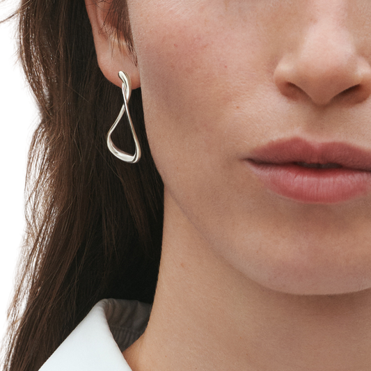Designed by Jacqueline Rabun as part of the iconic Mercy collection, these earrings are inspired by life's twists, turns, and personal journeys. Their sculptural shape gives them a unique personality that sets them apart from classic hoops, making them a piece you'll enjoy wearing for years to come.