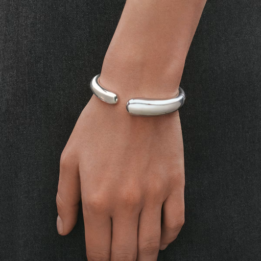 Designed by acclaimed jewellery designer Jacqueline Rabun, the Mercy collection celebrates the experiences, connections, and moments that shape our lives. The bangle’s organic form creates a beautiful sense of movement, making it a meaningful piece as well as a stunning design statement.
