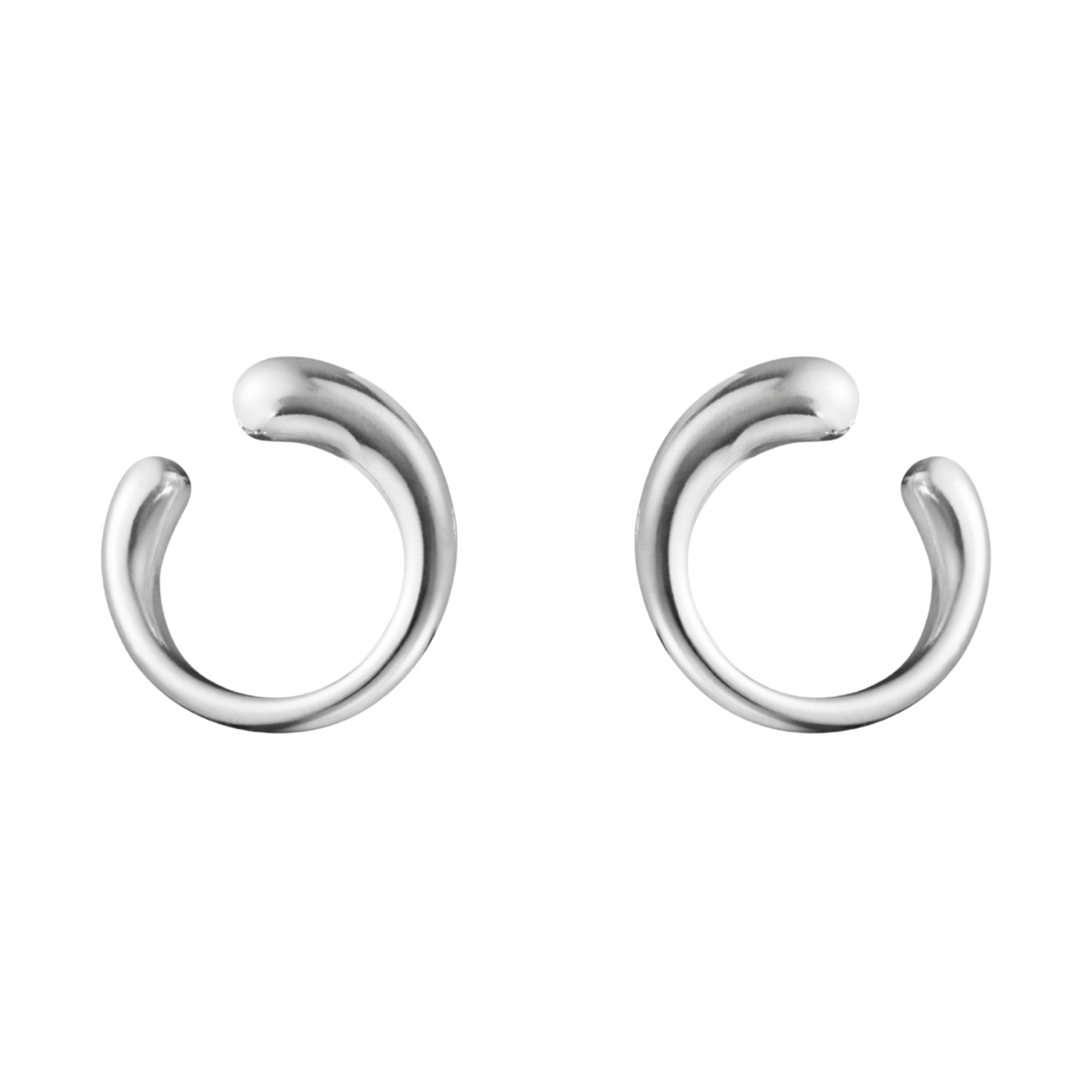 The Georg Jensen Mercy Silver Earring is a striking example of contemporary Scandinavian design, featuring a fluid, organic shape that gracefully follows the natural curve of the ear. 