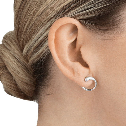 Bold yet beautifully understated, the Georg Jensen Mercy Silver Earring combines artistic craftsmanship with timeless wearability. Its sculptural design embodies modern luxury, making it a standout addition to any jewellery collection and a piece to treasure for years to come.