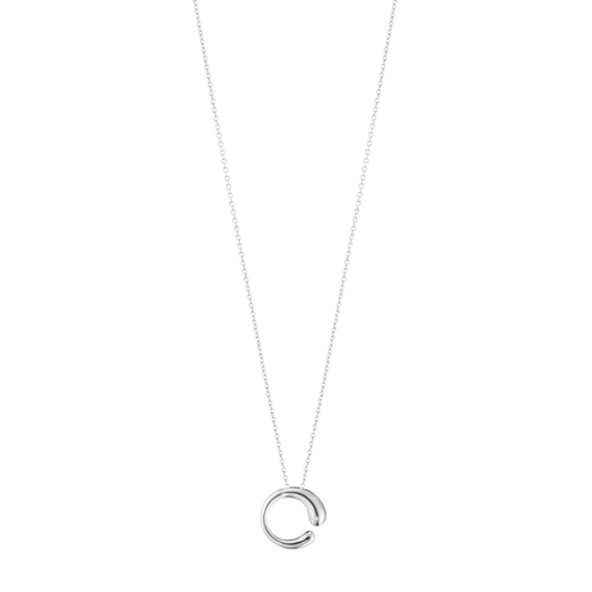 The Georg Jensen Mercy Medium Pendant is a striking expression of contemporary Scandinavian design.
Created by renowned designer Jacqueline Rabun, its flowing shape symbolises the twists and turns of life, resulting in a piece that feels both meaningful and effortlessly elegant.
