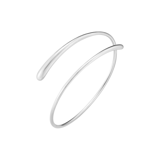 Created by jewellery designer Jacqueline Rabun, the piece forms part of the distinctive Mercy collection, characterised by soft organic curves and fluid forms that wrap elegantly around the body.