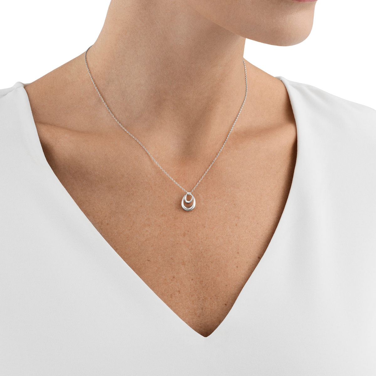Simple at first glance, it's the thoughtful details that make this necklace so special. The softly rounded pendant has a smooth, polished finish that sits comfortably against the skin, while the delicate silver chain keeps the overall look light, elegant and easy to wear every day.