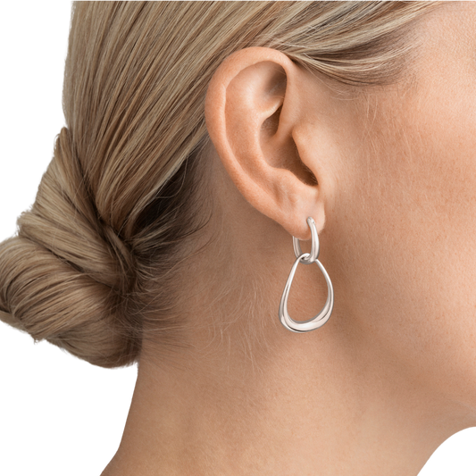 These earrings have a lovely sense of movement thanks to their elongated design. The polished sterling silver catches the light with every step, while the gently curved links give them a soft, graceful feel that's easy to wear from day to night.