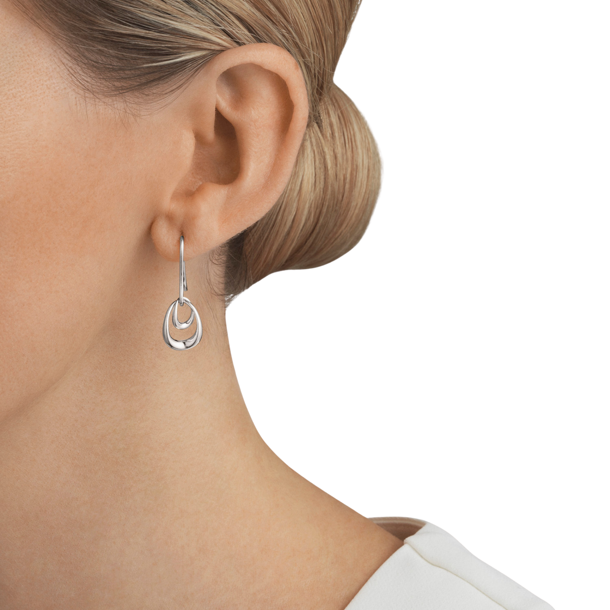 With their smooth curves and polished finish, these earrings have a clean, modern look that's easy to wear every day. They feel light on the ear while still making an impression, whether you're styling them with a crisp shirt for work or dressing up for an evening out.
