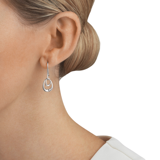 With their smooth curves and polished finish, these earrings have a clean, modern look that's easy to wear every day. They feel light on the ear while still making an impression, whether you're styling them with a crisp shirt for work or dressing up for an evening out.