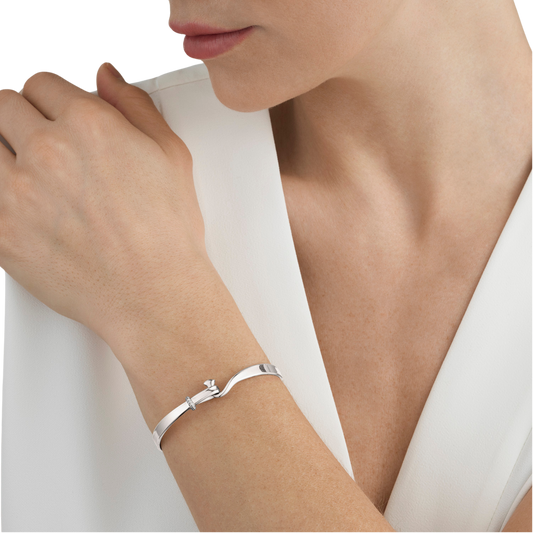 There's something incredibly easy to wear about this piece. The polished sterling silver has a soft, mirror-like finish, while the subtle diamond pavé catches the light naturally as you move. It's luxurious without feeling flashy, making it just as suited to everyday wear as it is to special occasions.