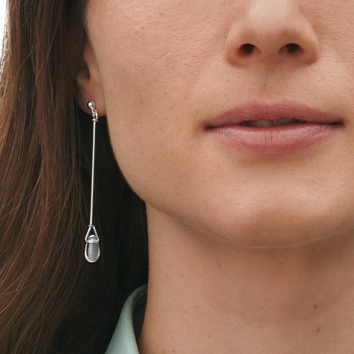Georg Jensen Torun sterling silver long drop earrings featuring natural rock crystal and a sculptural Scandinavian design
