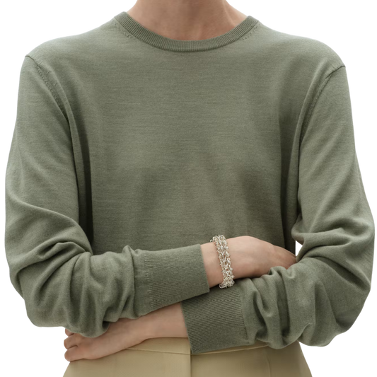 Georg Jensen Weft Sterling Silver Double Link Bracelet on a modal with a green jumper 