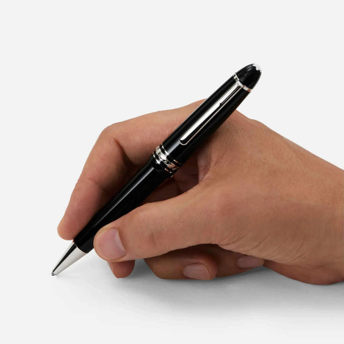 Hand writing with the Montblanc Meisterstück Platinum-Coated Classique ballpoint pen in black precious resin.