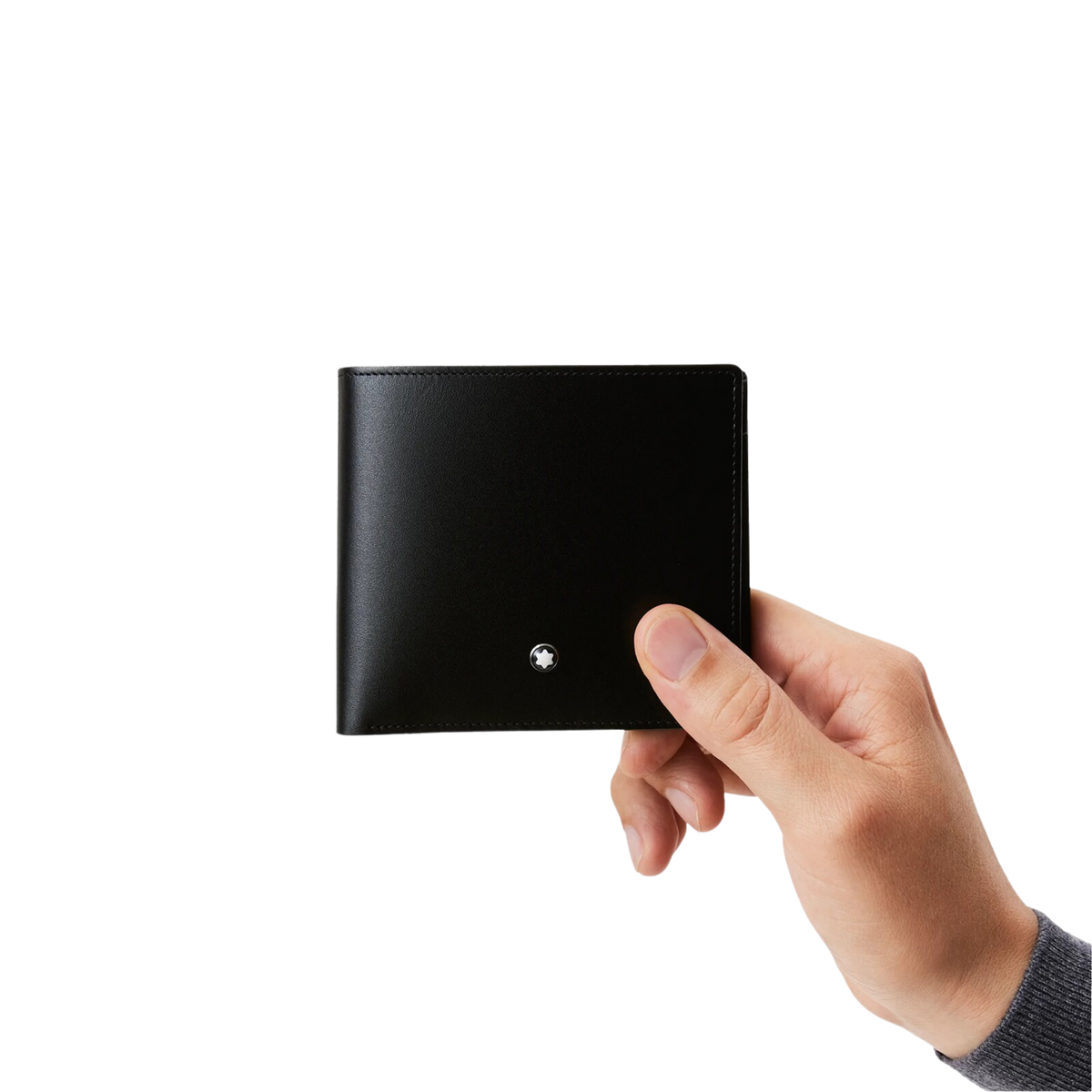 Hand holding the Montblanc Meisterstück black leather wallet for everyday use.