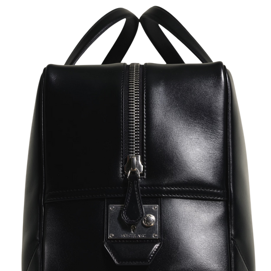 Rear view of the Montblanc Meisterstück 149 black leather bag showcasing its elegant minimalist design.