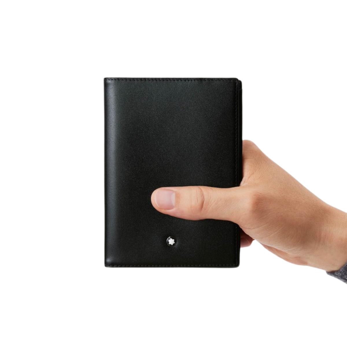 A person holding Montblanc Meisterstück Passport Holder Black Leather