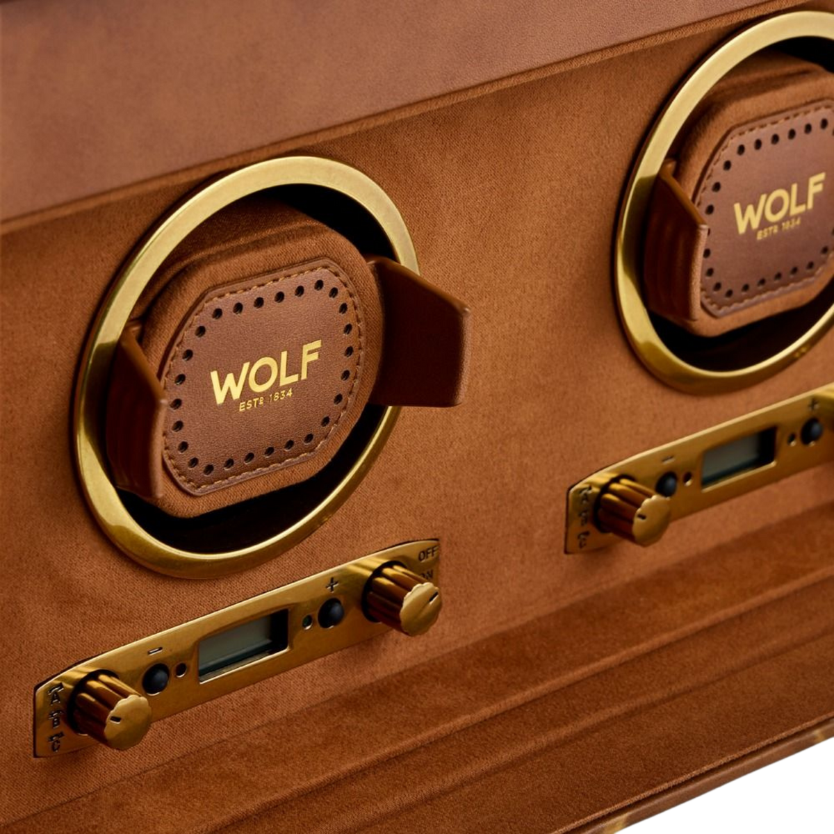 A beautifully crafted WOLF watch winder with space for two automatic watches, showcasing premium leather detailing, gold-tone accents and timeless collector appeal.