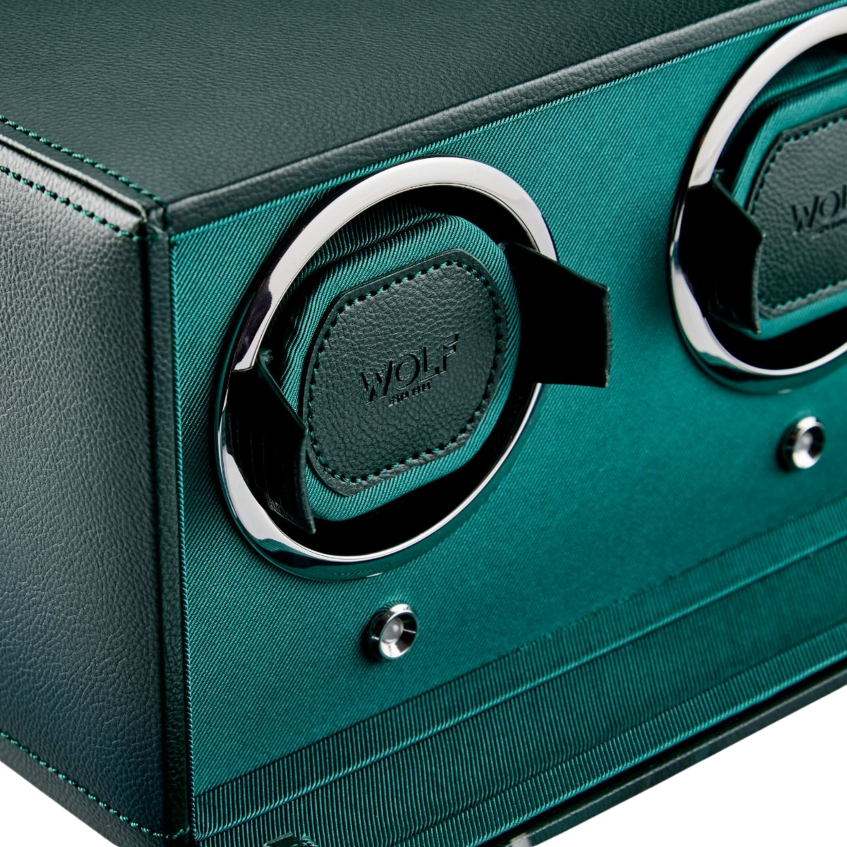 A close-up of the WOLF Cub Winder highlights its rich green vegan leather exterior and refined stitching, demonstrating the brand’s attention to detail and sustainable craftsmanship. The textured finish enhances its premium feel while protecting watches from dust, scratches, and environmental exposure.