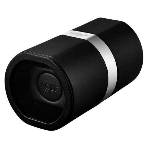 The Wolf Rocket Watch Winder in Black is a compact, travel-ready automatic watch winder finished in smooth vegan leather with refined chrome detailing. Designed for portability and precision, its sleek cylindrical form protects your timepiece while maintaining a modern luxury aesthetic ideal for frequent travellers and collectors.