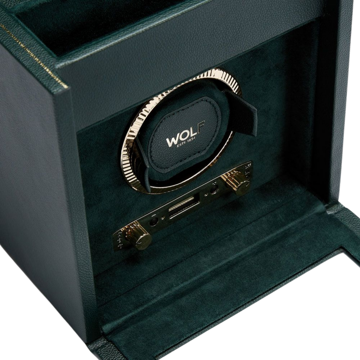 Opened to reveal its precision-engineered interior, the British Racing Single Watch Winder features a secure winding module designed to hold and rotate an automatic timepiece with absolute stability. Integrated storage compartments and suspended cushions add practicality, making it ideal for both display and everyday use.