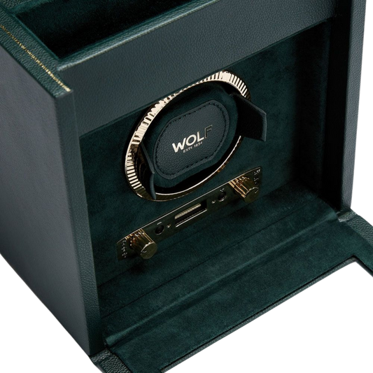Opened to reveal its precision-engineered interior, the British Racing Single Watch Winder features a secure winding module designed to hold and rotate an automatic timepiece with absolute stability. Integrated storage compartments and suspended cushions add practicality, making it ideal for both display and everyday use.