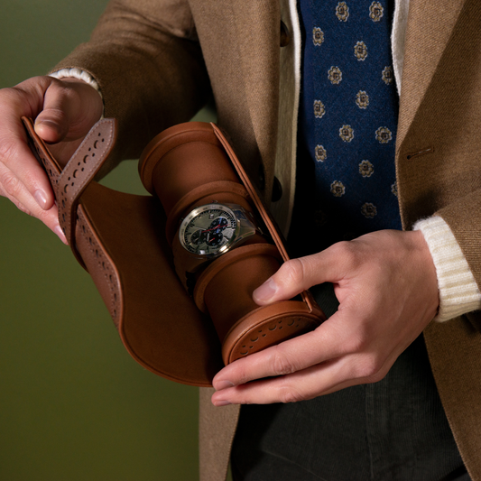 Crafted in rich burnished brown leather, the Wolf Brogue Triple Watch Roll brings together traditional craftsmanship and timeless style. Inspired by classic brogue detailing, it's a sophisticated way to store and showcase your favourite watches.
