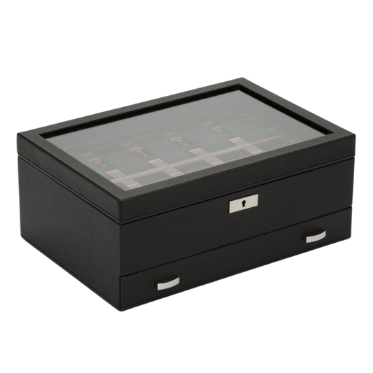 The WOLF 1834 Roadster 10 Piece Watch Box with Drawer takes its design cues from iconic British sports cars.
Finished in black vegan leather with ebony macassar wood detailing, it combines automotive-inspired styling with luxury watch storage.
A striking display piece for collectors who appreciate craftsmanship and heritage.