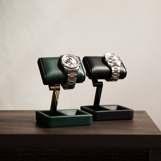 Whether placed on a bedside table, desk, or dressing area, this elegant watch stand keeps your watch beautifully presented and always within reach. The sophisticated black finish adds a touch of luxury to any space while complementing both modern and classic interiors.