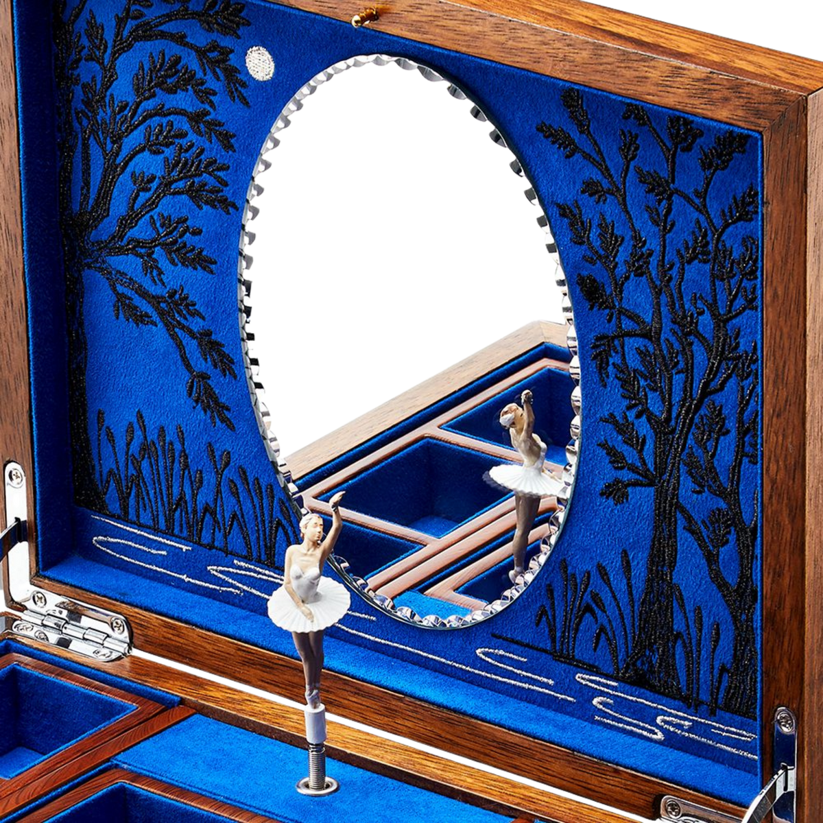 From the rich walnut veneer exterior to the carefully embroidered interior designed by Fiona Howard, every element has been thoughtfully considered.
The elegant oval marquetry detail and polished hardware add depth and character, creating a jewellery box that feels both timeless and distinctive.