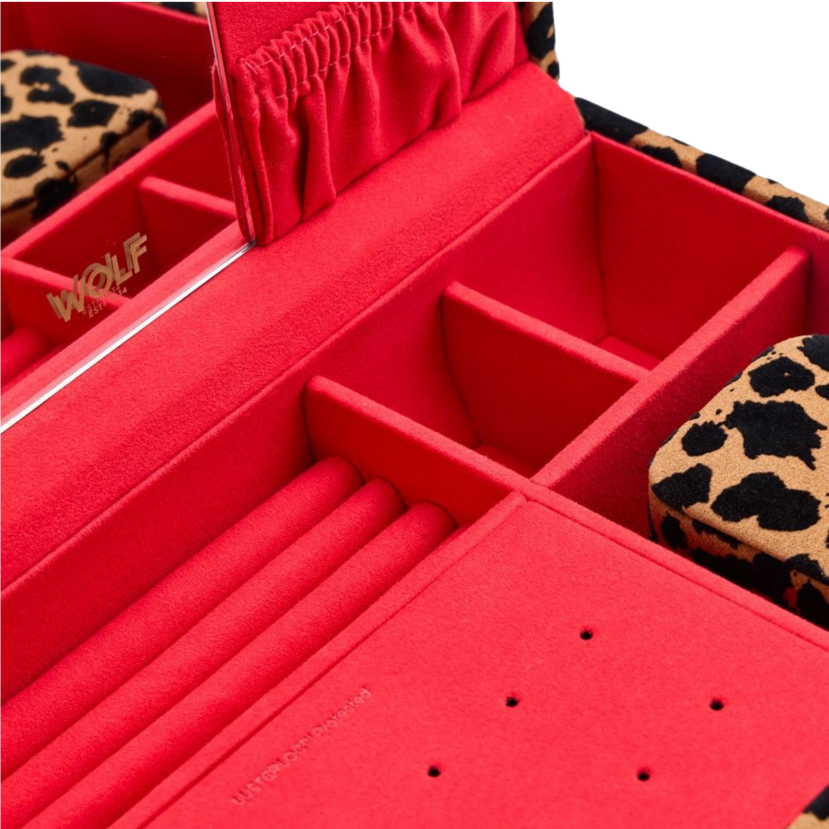 The combination of the leopard print exterior and vibrant red interior creates a dramatic visual contrast.
Finished with gold-tone hardware and WOLF's signature attention to detail, the jewellery box balances bold styling with a polished, luxury finish.
Designed to stand out while remaining timeless.
