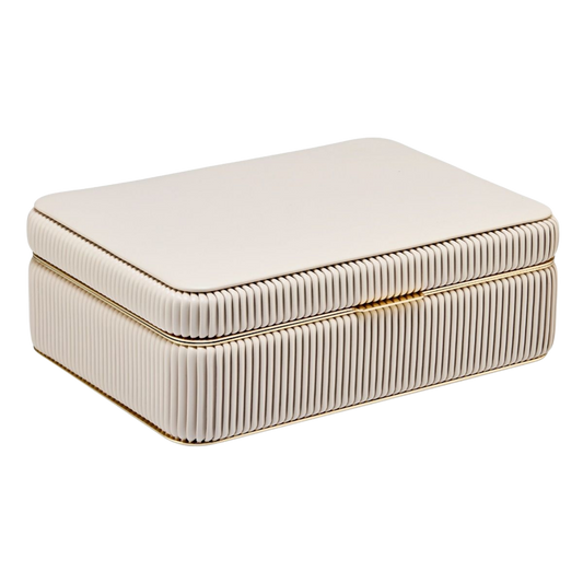 The Wolf Bella Medium Jewellery Box in Bone brings a soft, sophisticated look to jewellery storage.
Its neutral tone, pleated detailing, and gold-tone accents create an effortlessly elegant piece that complements both contemporary and classic interiors.
Designed to be as beautiful on display as it is practical to use.