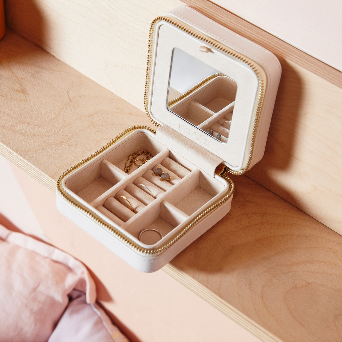 Finished in a fresh white shade, the Wolf Maria Zip Jewellery Cube blends luxury craftsmanship with everyday practicality. Complete with Wolf's signature LusterLoc™ lining to help protect against tarnishing, it's a stylish storage solution for modern jewellery lovers.