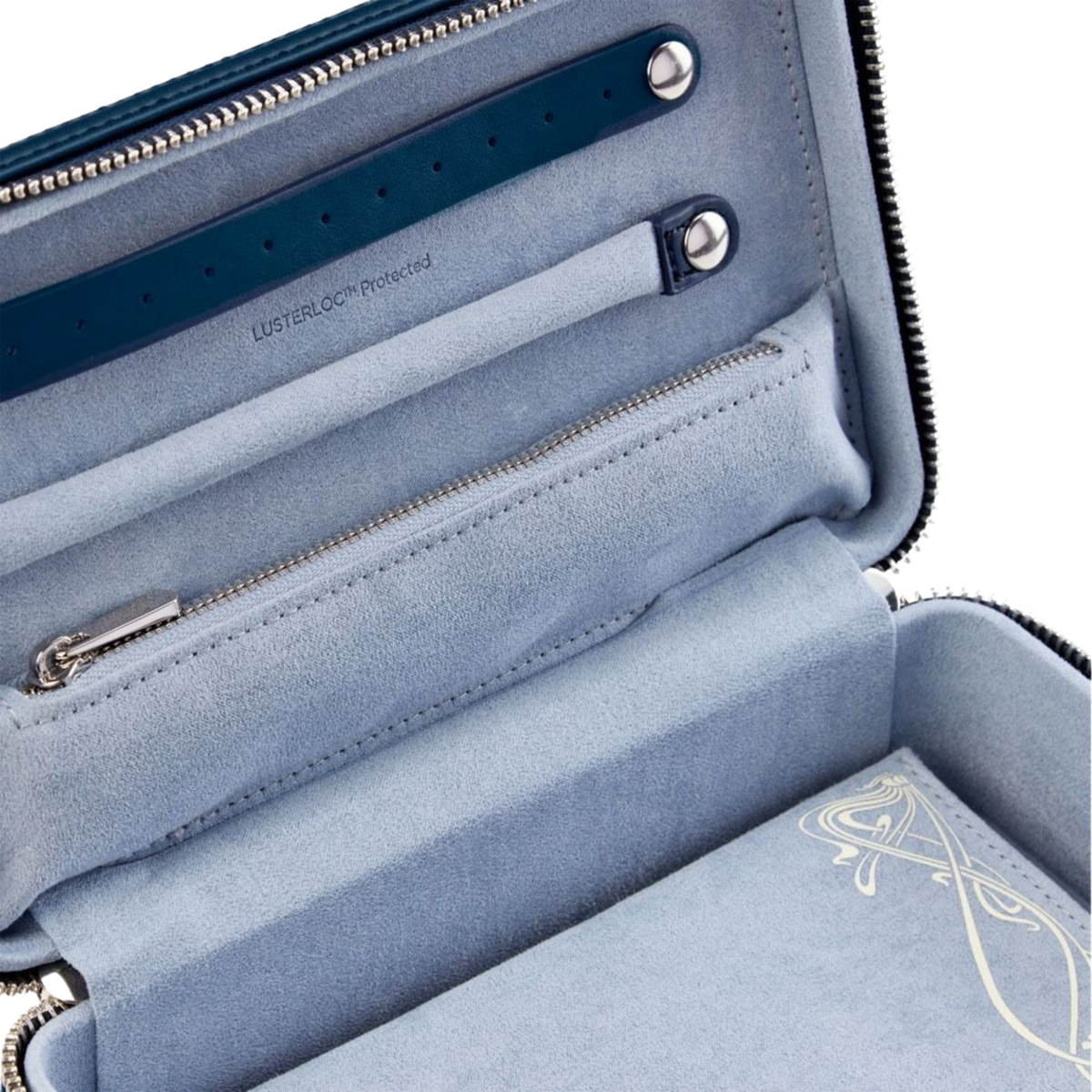 Inside the Wolf x Liberty Medium Zip Case, thoughtfully arranged compartments and soft protective lining keep rings, necklaces, and earrings secure, ensuring jewellery stays tangle-free and perfectly organised while travelling.
