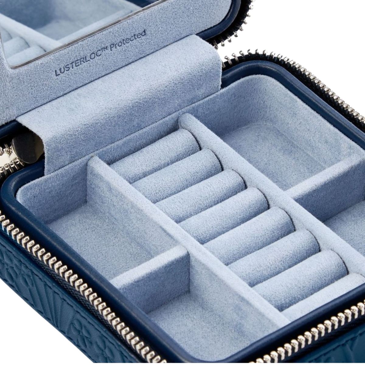 Finished in a deep navy tone, this Wolf x Liberty zip case features a refined textured exterior and secure zip fastening, offering a stylish yet practical way to keep treasured jewellery safely stored on the move.