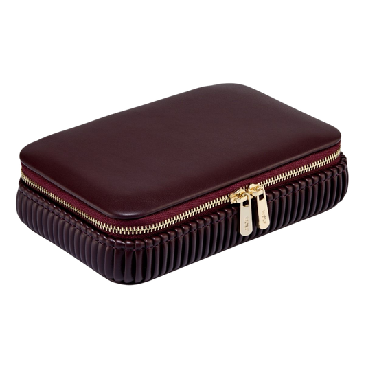 From the smooth vegan leather exterior to the softly pleated sides and gold-finish accents, every detail of the Bella collection has been carefully considered.
The Bordeaux finish adds warmth and sophistication, creating a jewellery case that feels both contemporary and enduring.