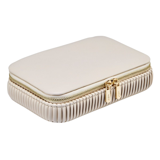 The Wolf Bella Zip Case in Bone exudes understated luxury with its smooth vegan leather exterior, elegant pleated detailing, and polished gold-tone hardware, creating a sophisticated home for your most treasured jewellery pieces.